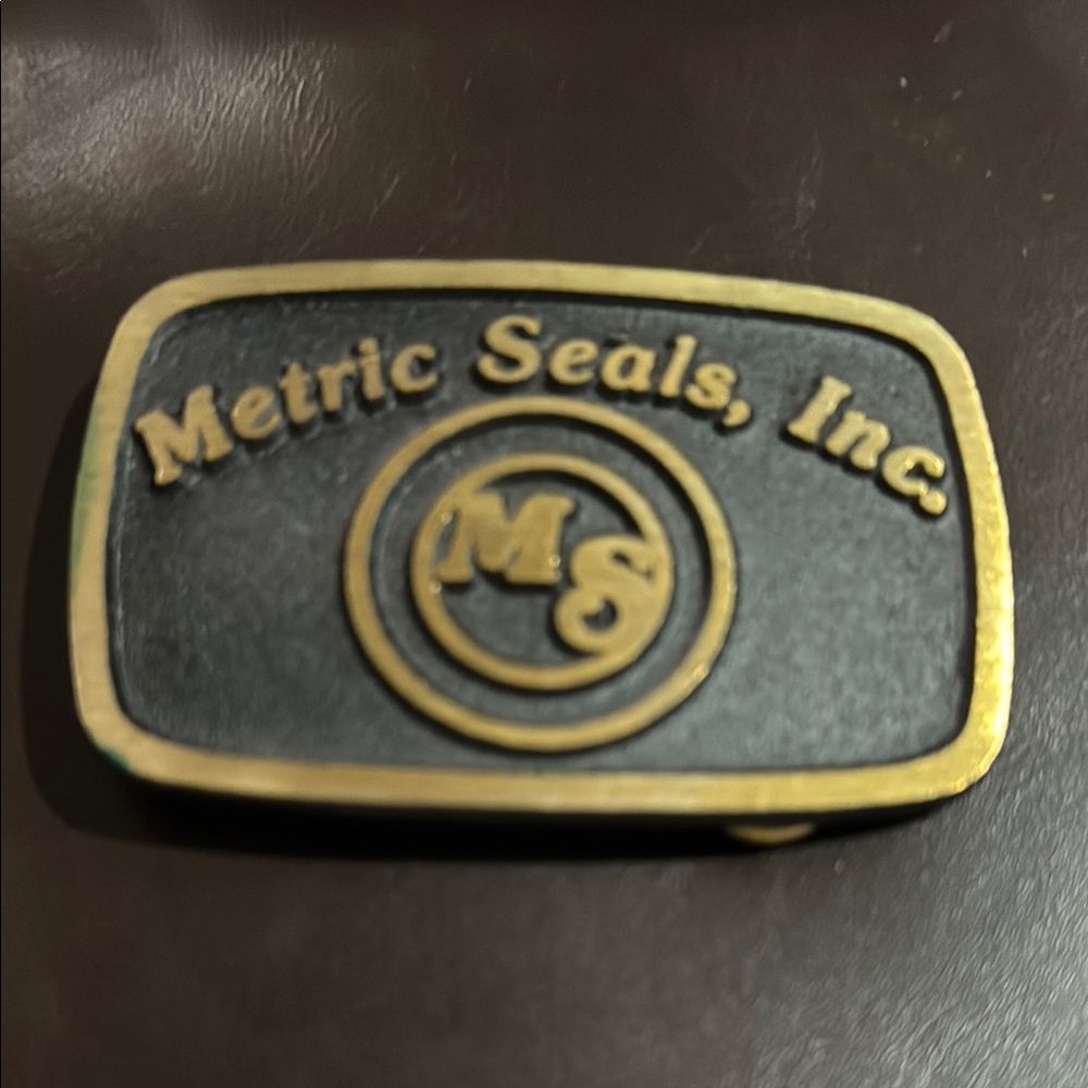 Black and Gold Metric Seals Belt Buckle